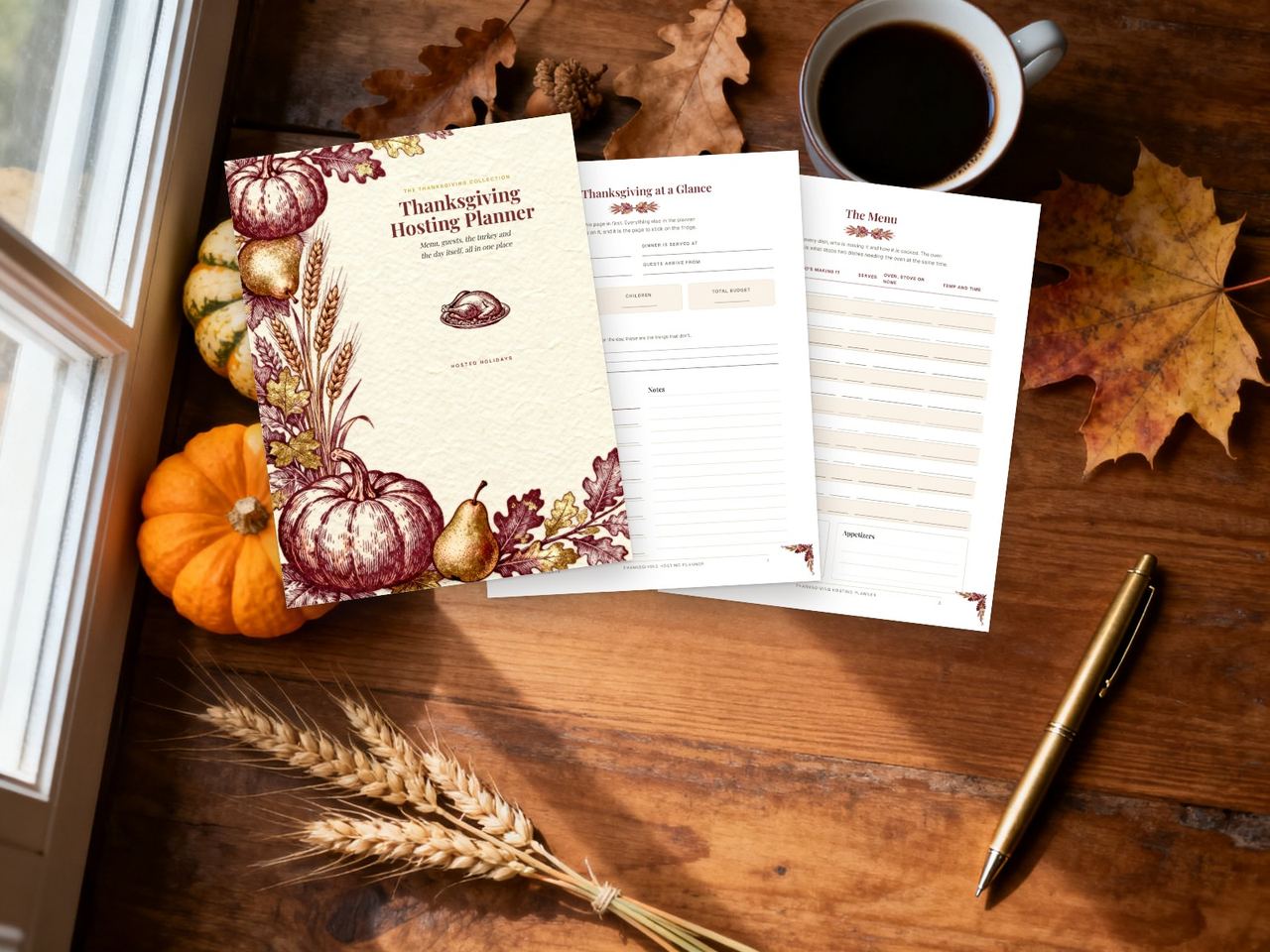 The Thanksgiving Hosting Planner printed out on a wooden table with pumpkins and coffee